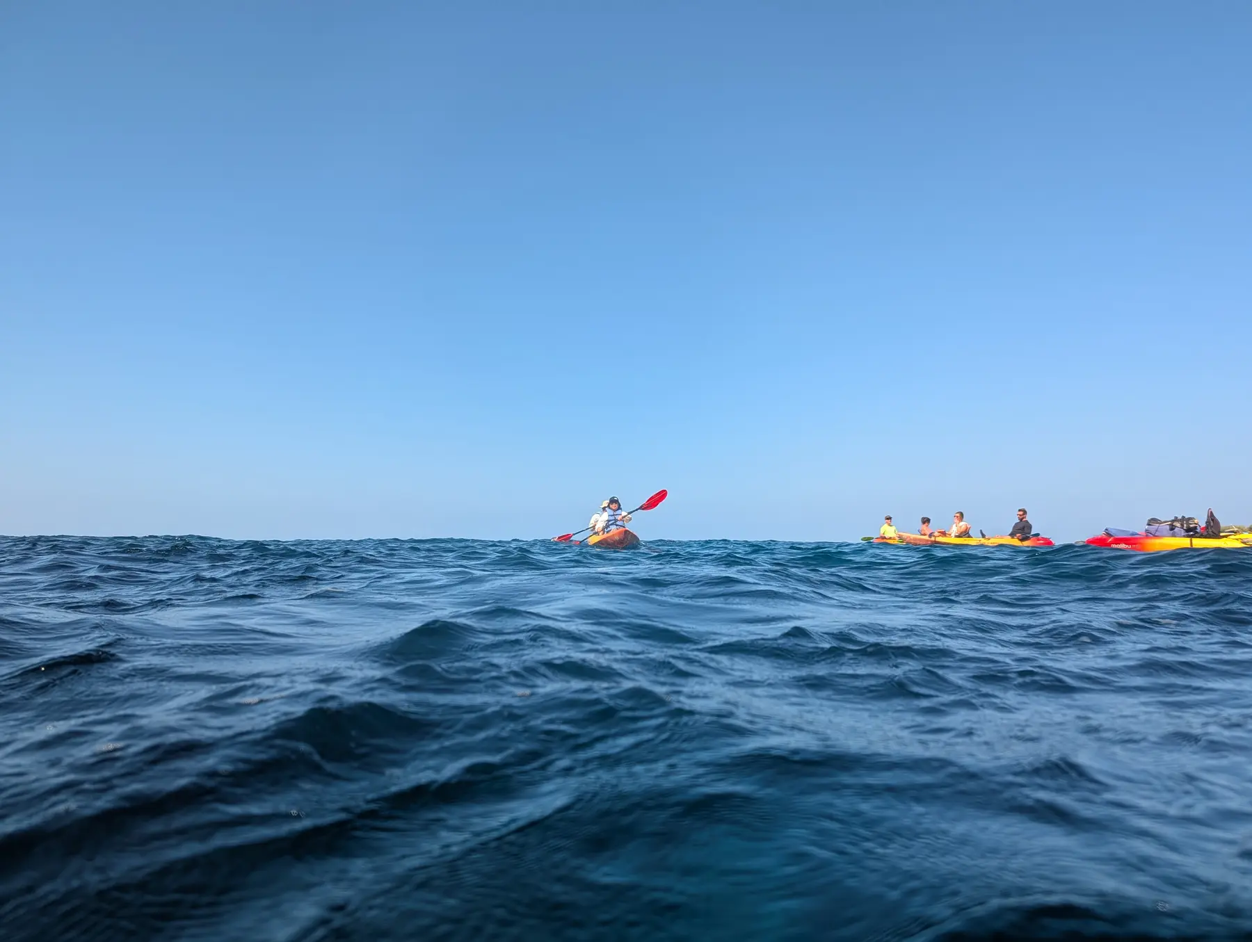 Kayakers traveling along the Kona Coast