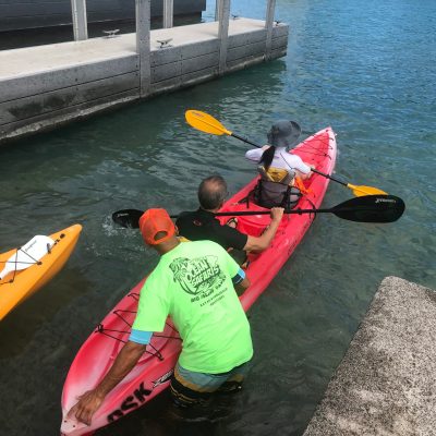 a group of people on a boat in the water