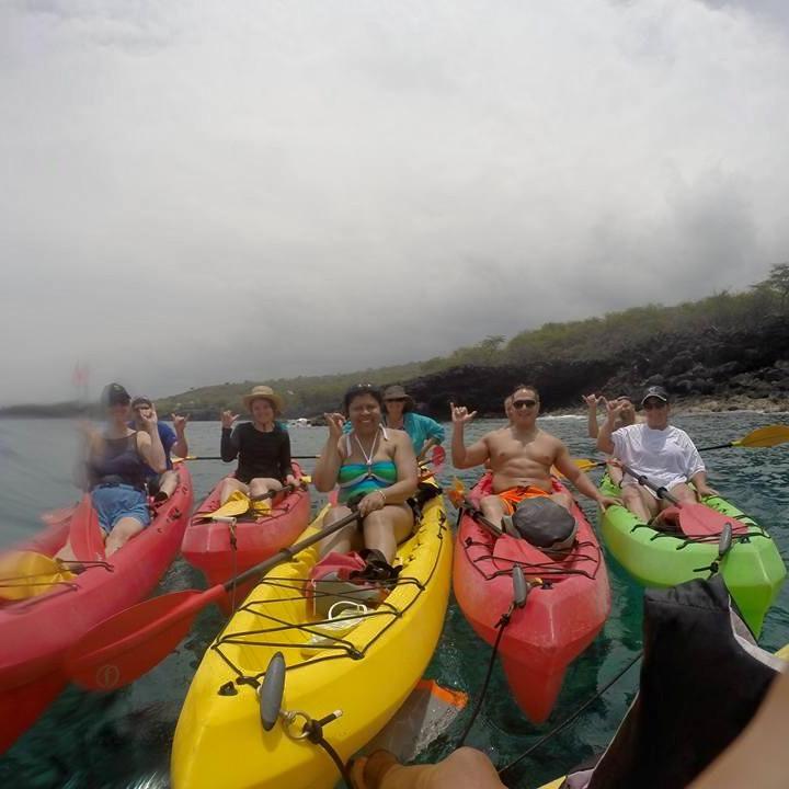 a group of people in a boat on a body of water
