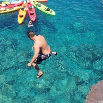 a person swimming in a pool of water