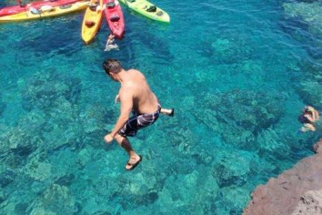 a person swimming in a pool of water