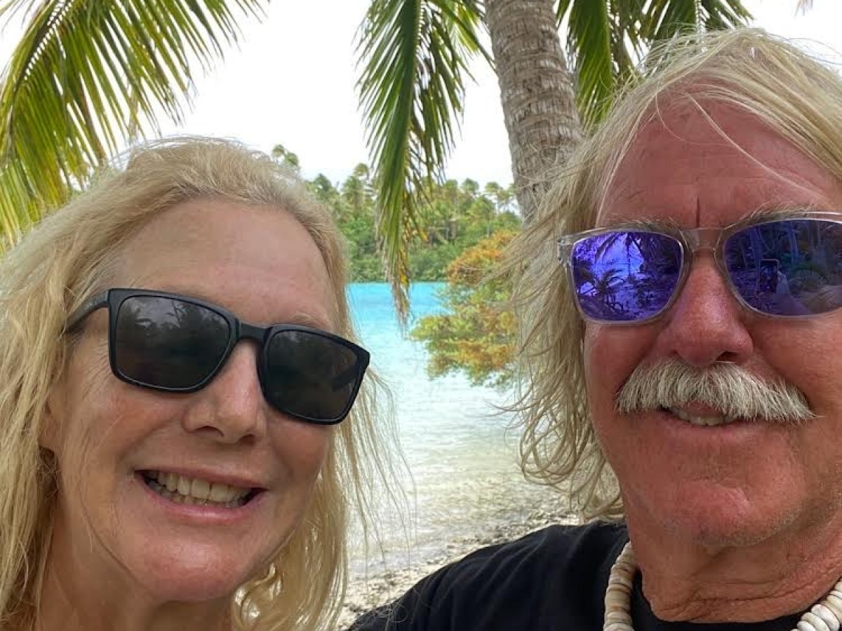 a woman wearing sunglasses posing for the camera